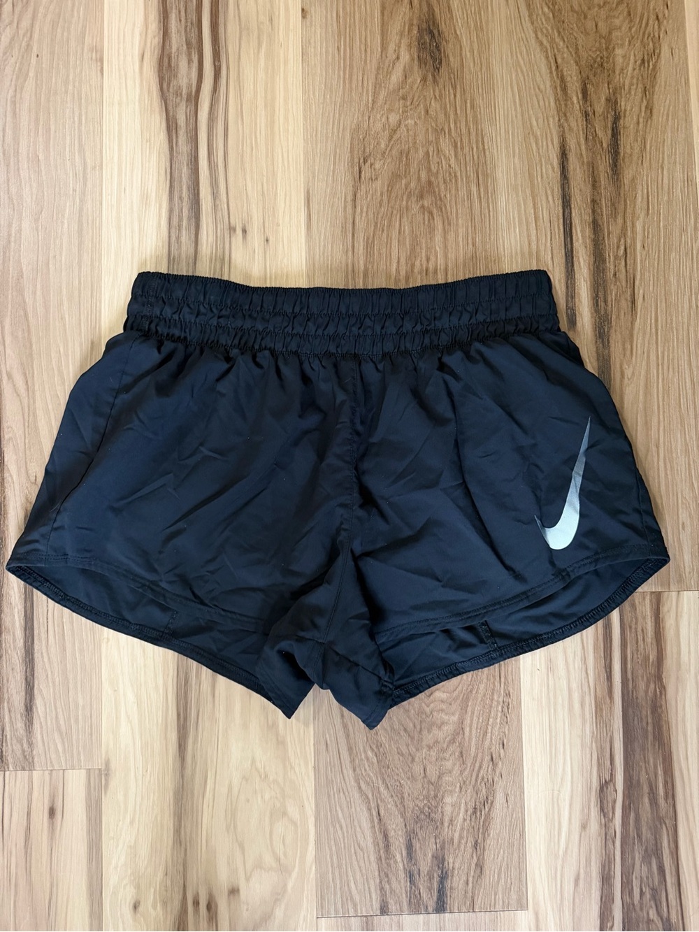 Nike Women’s Black Athletic Shorts with Silver Swoosh